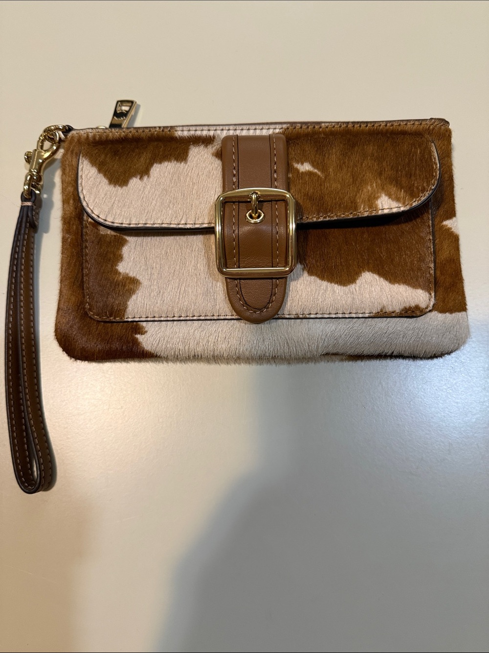 Coach Brown and White Cowhide Wristlet Clutch with Gold Buckle